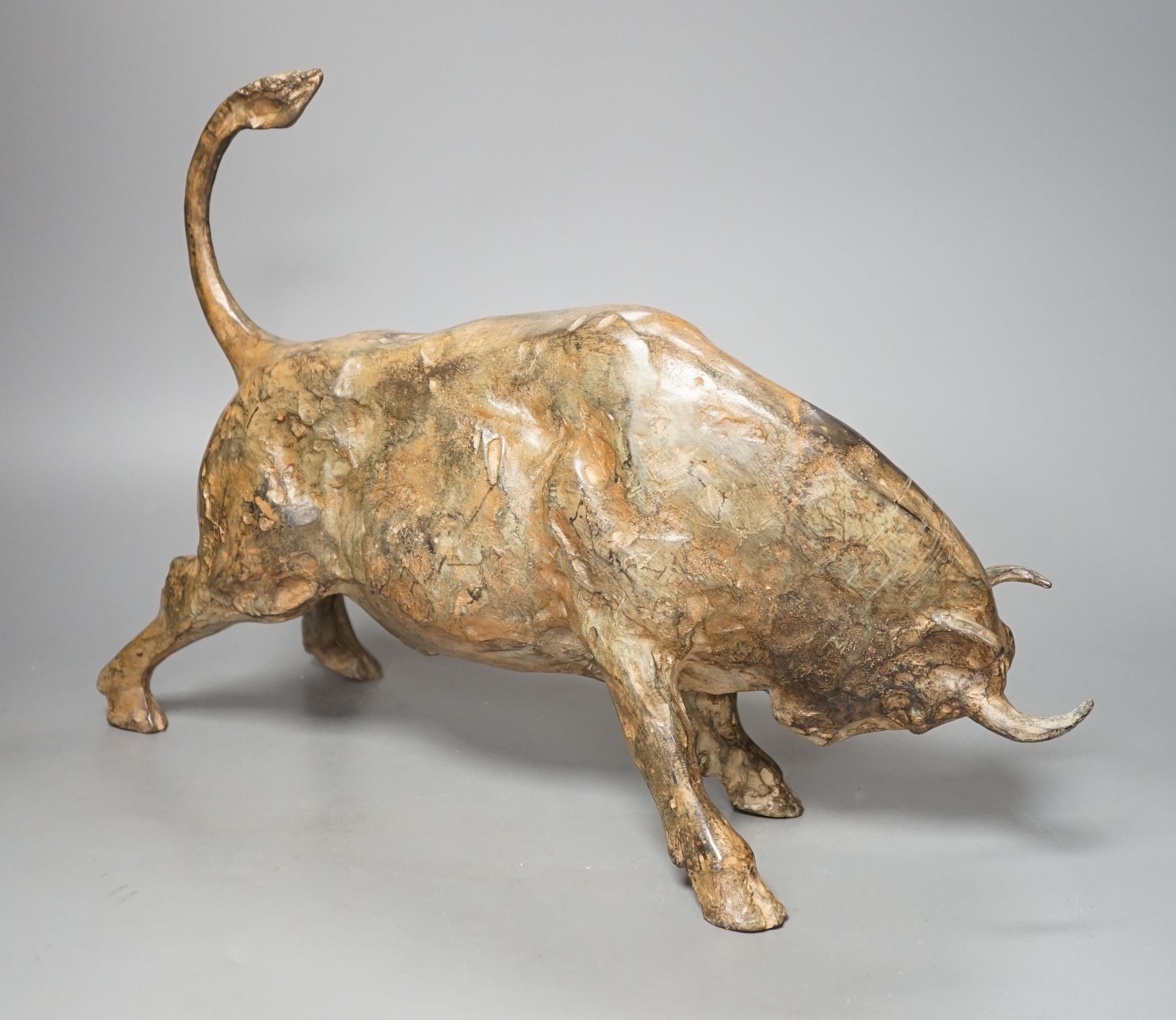 Pierre Chenet Foundry, a patinated bronze of a charging bull, length 39.5cm, signed